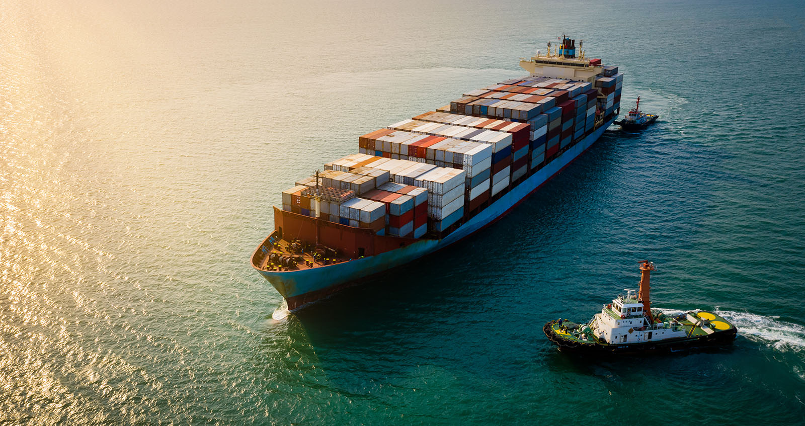 Container ship docked at a busy port